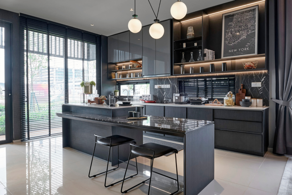 Dark kitchen with black marble countertops and pendant lighting